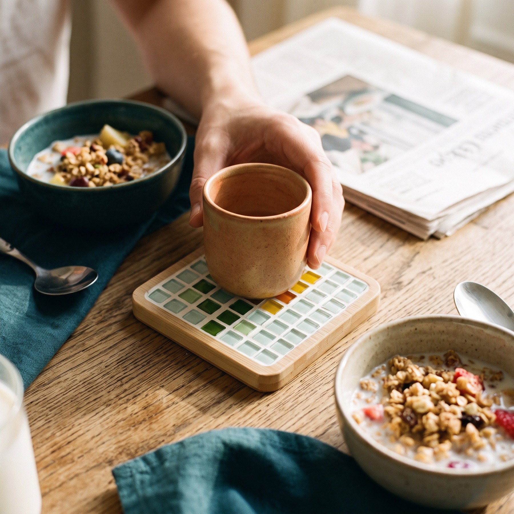 A handmade mosaic coaster bringing colour to a home desk